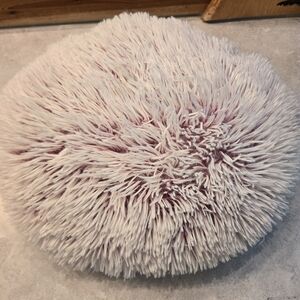 Very cute, fluffy, and soft gray throw pillow with pink undertones. Great shape